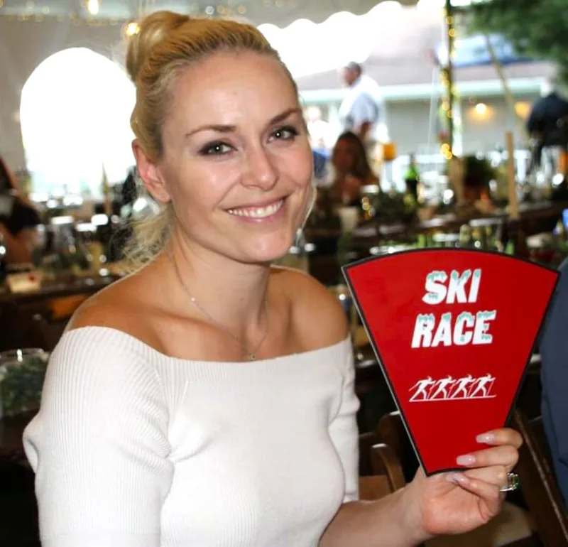 Lindsey Vonn holding the Ski Race insert from Scott's Wedding Wheel Dinner Show